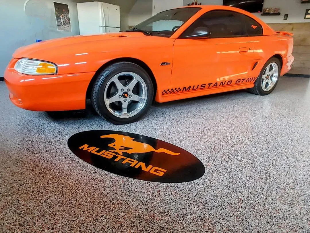 Orange mustang on shoreline floor